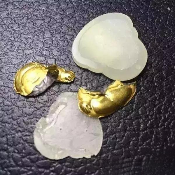 Broken jade pendant showing thick glue.