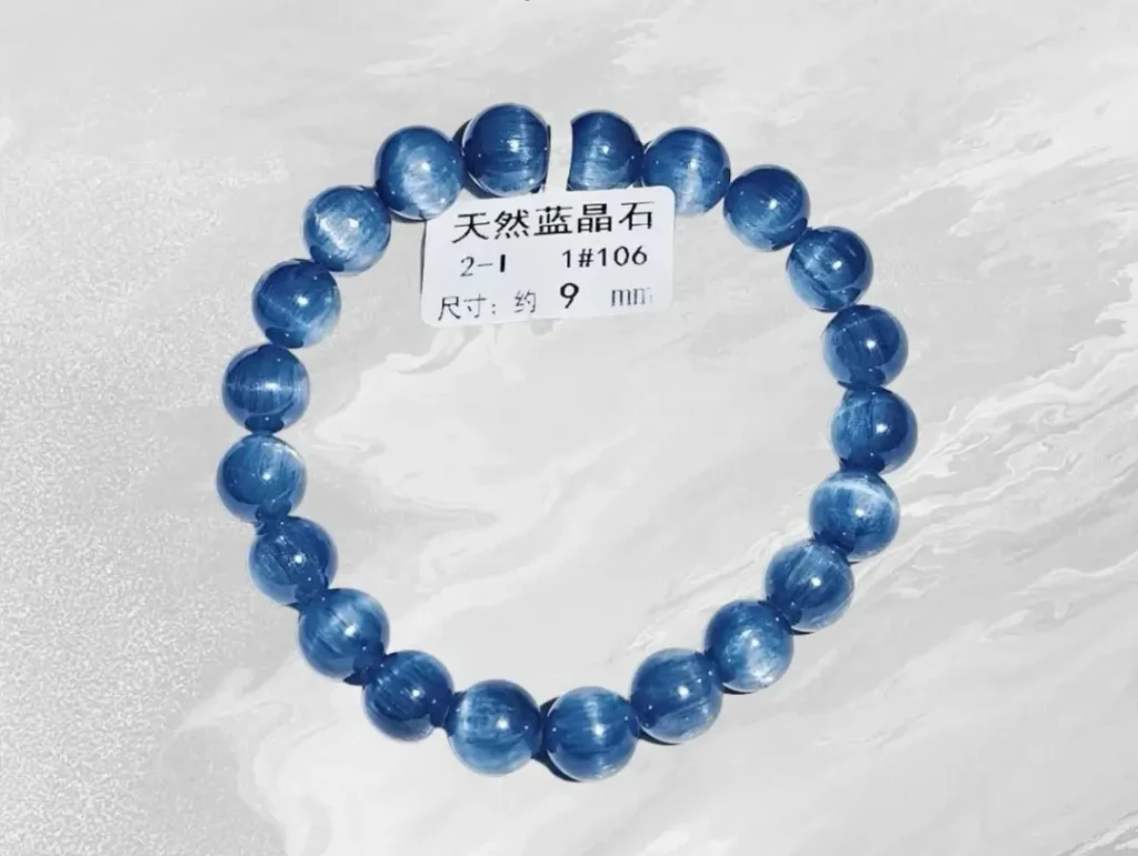Commercial-grade blue mineral bracelet showing typical banding patterns and standard polished luster for daily wear.