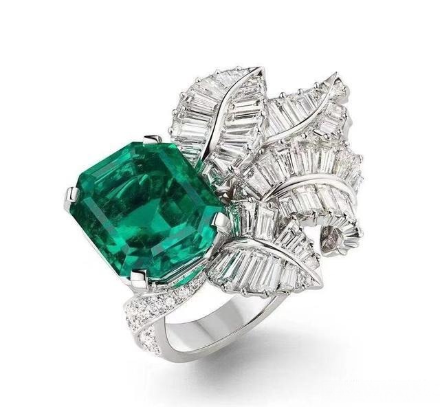 An emerald ring exhibiting obvious quality issues, such as visible filler and fissures, disqualifying it from top color grades.