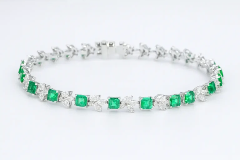 Featured image: Custom 18k gold bracelet by Jewea, meticulously set with natural emeralds and brilliant cut diamonds.