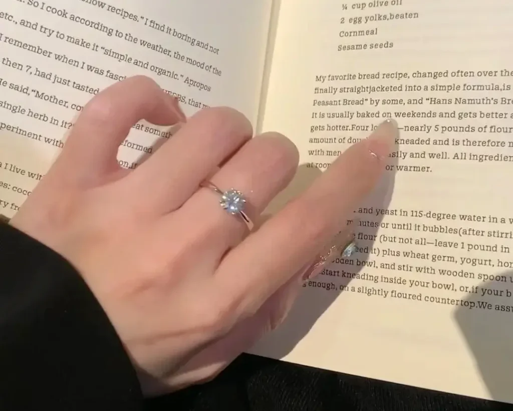 Customer wearing a custom Jewea Moissanite engagement ring, showcasing durability as a strong alternative in the Moissanite vs Diamond debate.