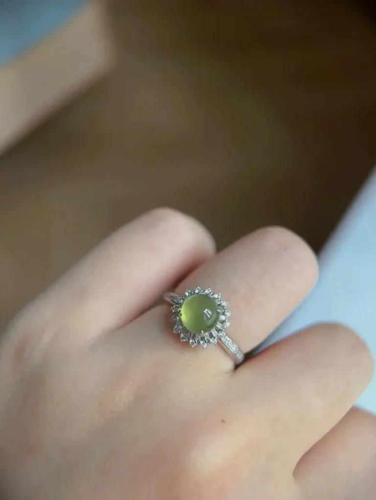 A custom Jewea ring featuring a warm, natural Yellow Jadeite cabochon set in a bespoke jewelry design.