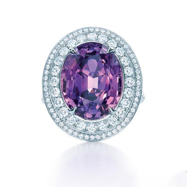 Elegant ring featuring a vivid purple sapphire center stone surrounded by brilliant white diamonds.