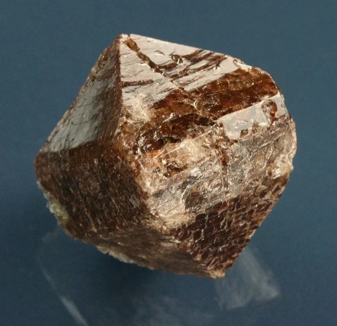 A specimen of rough Zircon mineral crystals, showing its natural form before cutting and polishing.