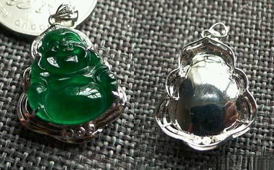Disassembled Yongchu jade pendant showing thin hollowed jade and closed-back metal setting.