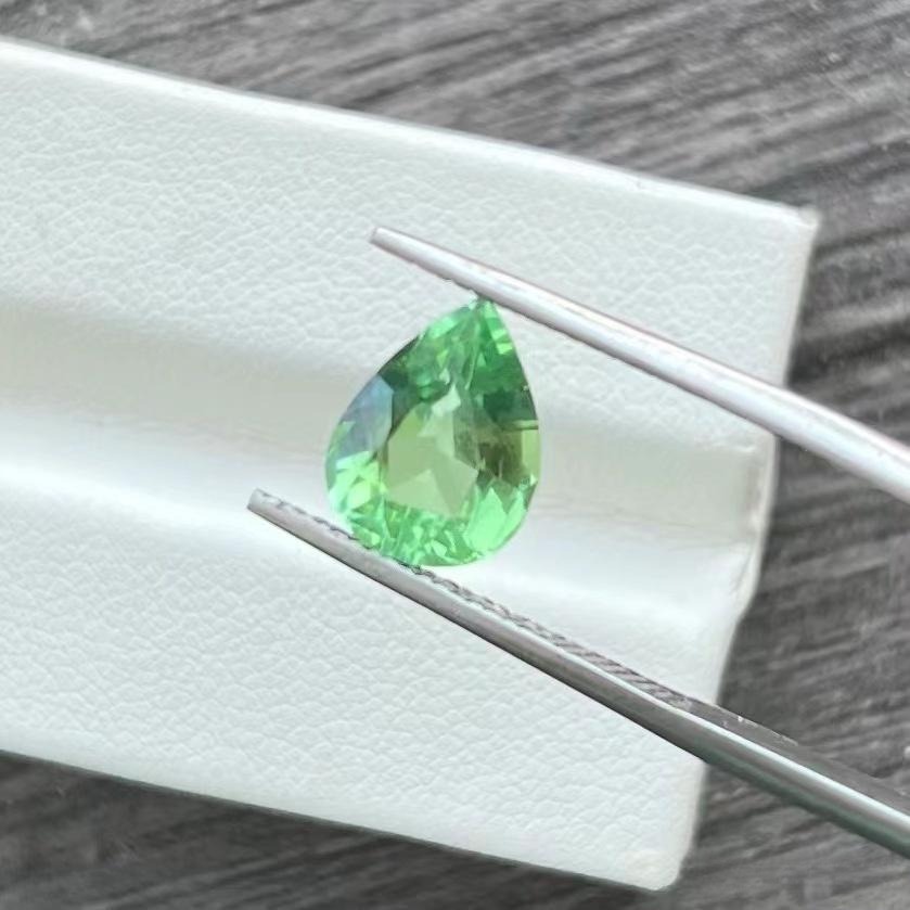 A 2.51ct loupe-clean pear-shaped Afghan mint green tourmaline with exceptional brilliance.