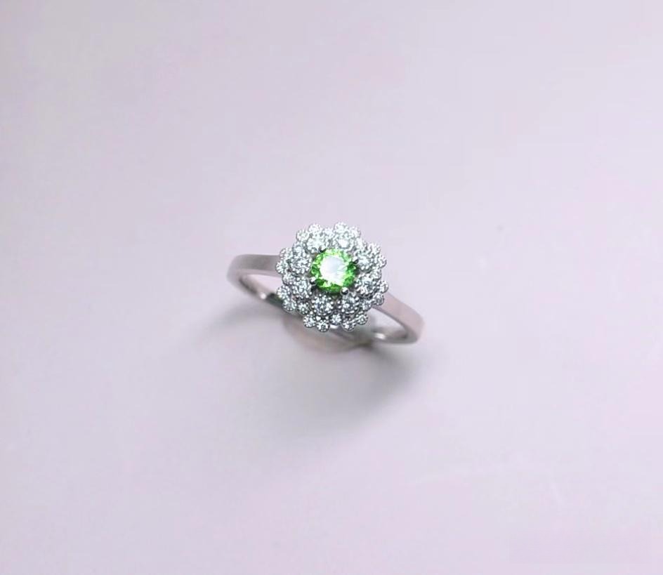 Jewea custom round cluster Tsavorite garnet ring showcasing vibrant green gemstones in floral arrangement.