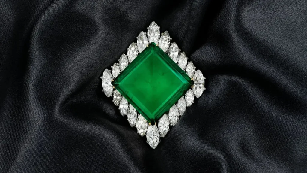 The Aga Khan brooch featuring a 37-carat Colombian Muzo emerald surrounded by diamonds.
