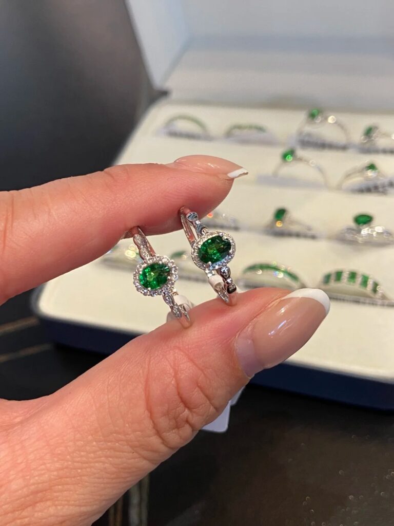 Bespoke 18K gold ring featuring a vivid Kazani Green Garnet in a vintage-inspired setting.