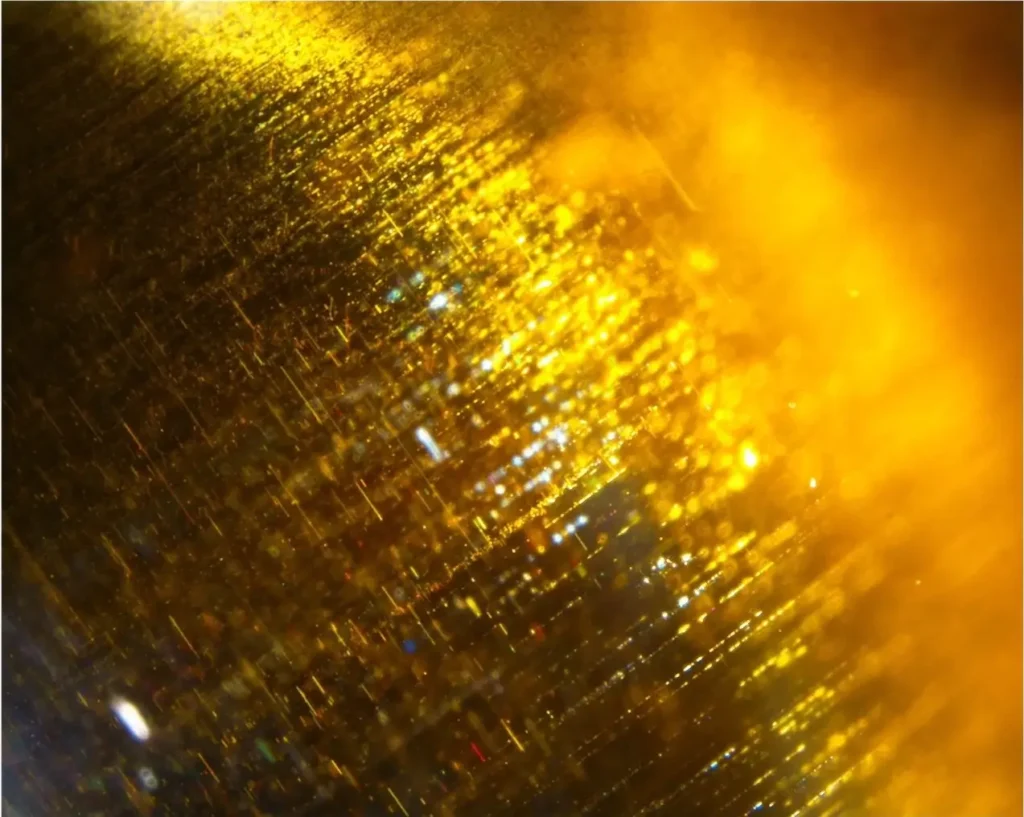 Close-up of Chrysoberyl Cat’s Eye showing dense, parallel needle-like inclusions responsible for its chatoyancy effect.
