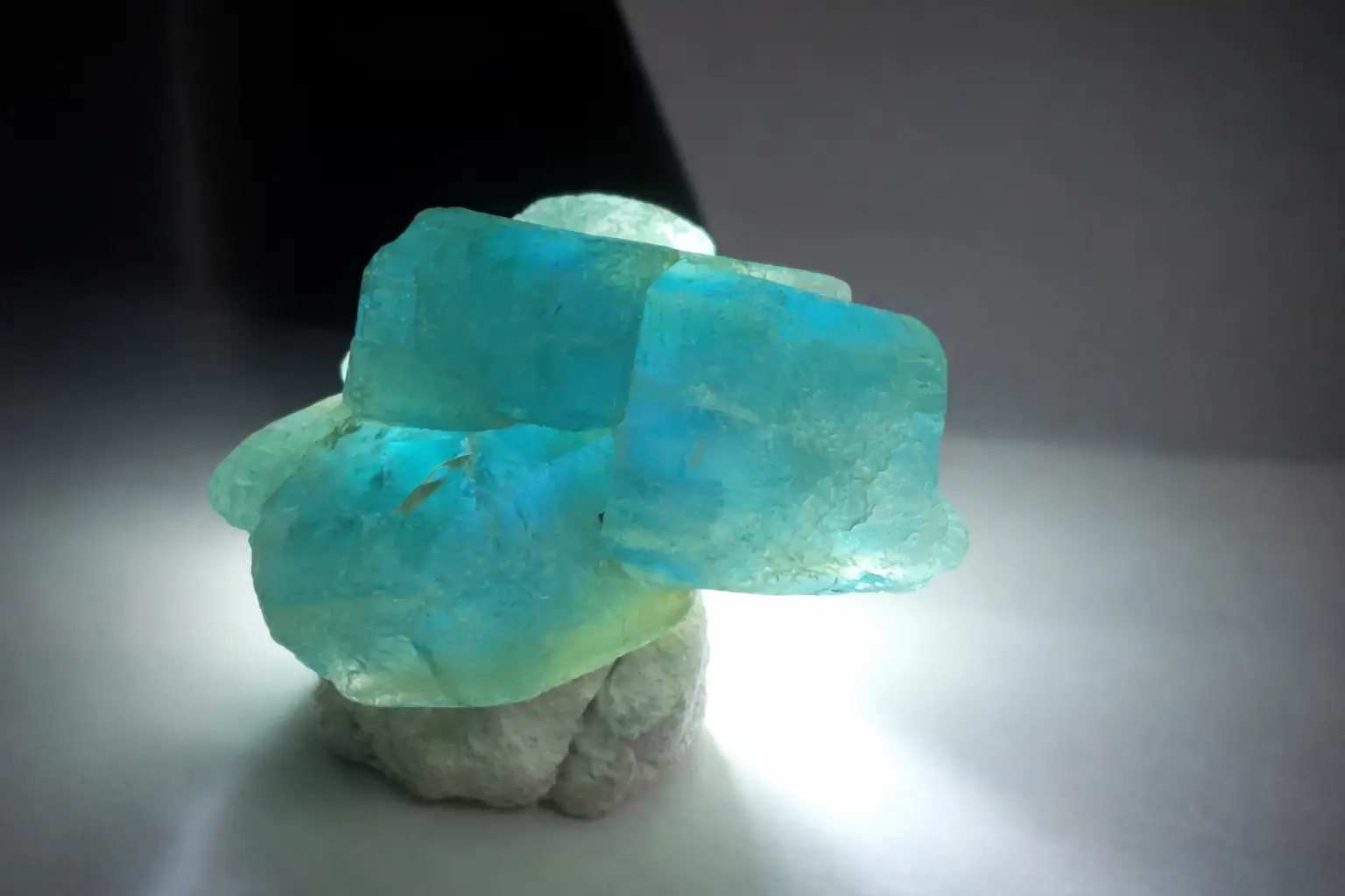 Rare Chinese apatite crystal displaying Paraiba color with strong pleochroism, now extinct and highly collectible.