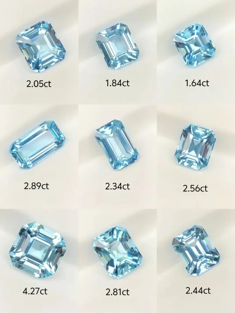 Selection of 5A grade aquamarines in various sizes featuring light blue to pale grayish-blue tones.