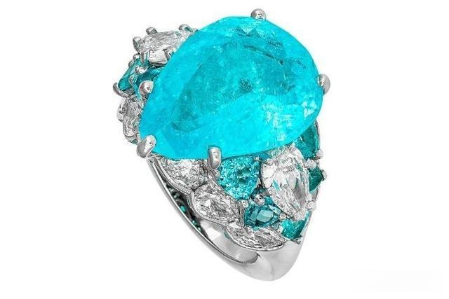 David Morris Paraiba tourmaline ring featuring vivid neon blue-green gemstone set in elegant gold band.