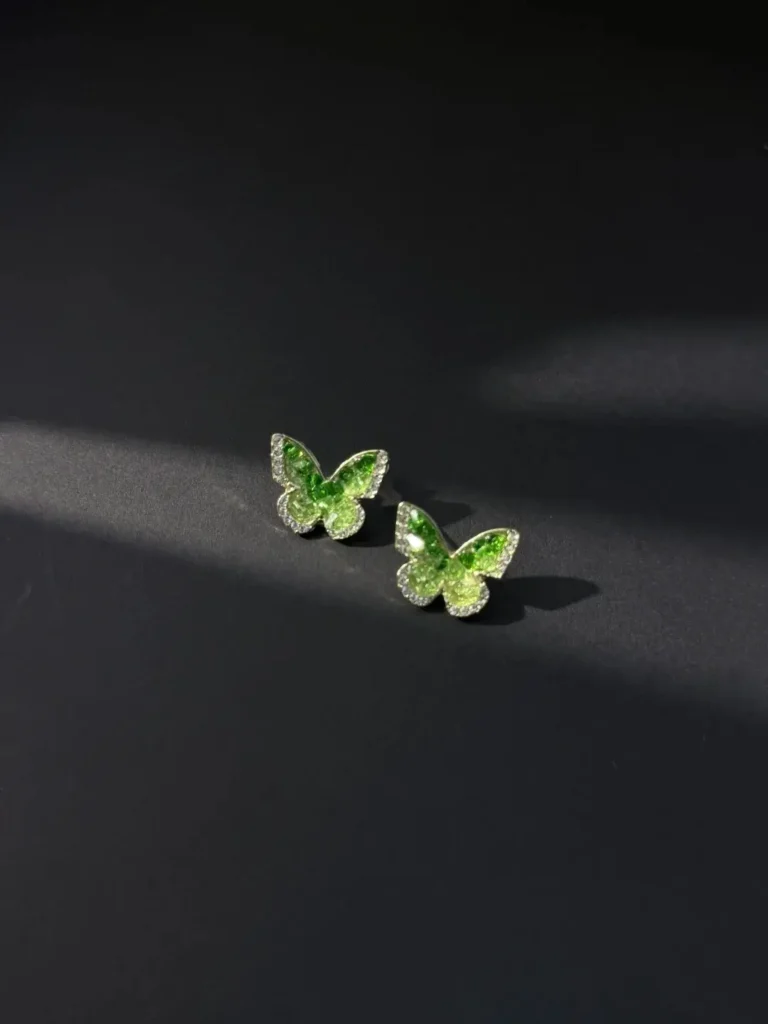 Butterfly earrings featuring rare prasiolite (green quartz) gemstones set in alloy silver posts.