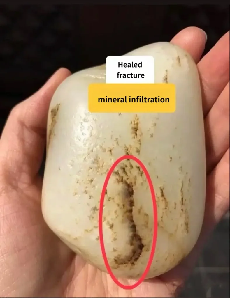 Internally healed stone veins in Hetian nephrite jade showing natural mineral infiltration without surface texture.