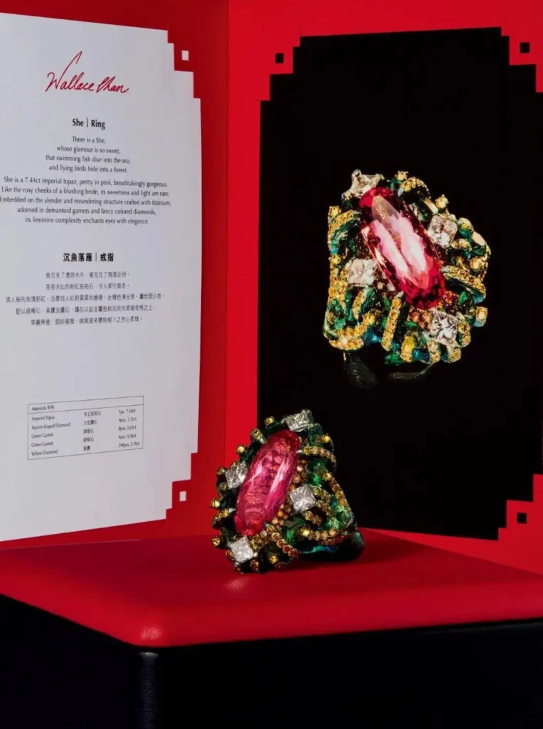 High-jewelry ring displayed alongside an official studio certificate of authenticity for the gemstone.