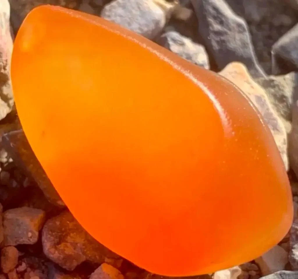 Jinsi Jade rough stone showing semi-transparent to opaque quartzite structure from Xinjiang.