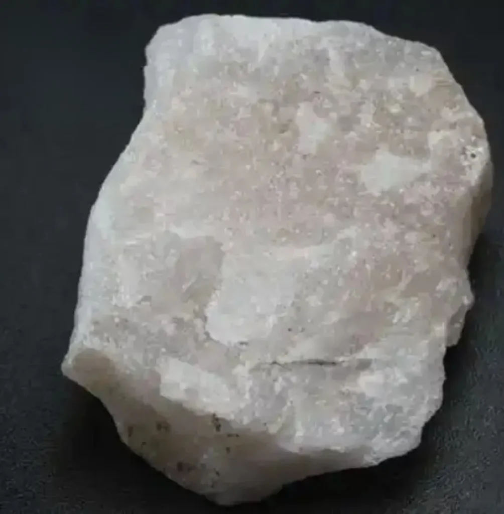 Raw macrocrystalline quartz varieties featuring a cluster of visible hexagonal crystal points.