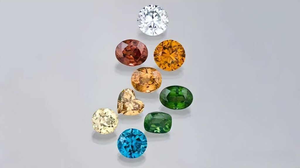Faceted blue, yellow, and red natural zircons with intense fire, premium Thailand gemstones.