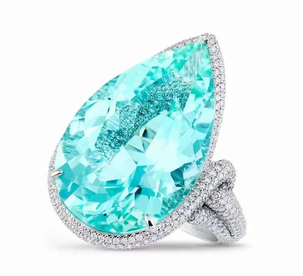 Neon blue Paraiba tourmaline ring featuring a vivid copper-bearing gemstone with high saturation