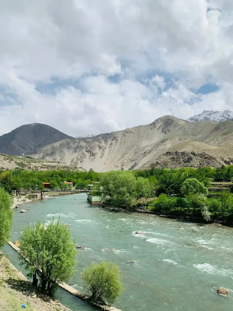 Wide landscape view of the rugged Panjshir Valley mountains, the primary source of Afghan emeralds.