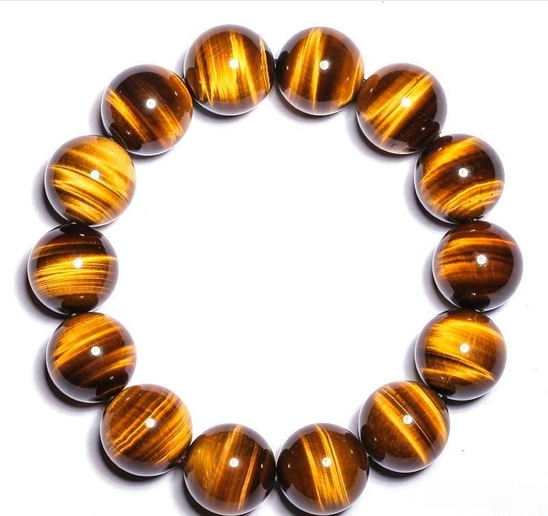 A polished Tiger’s Eye beaded bracelet showing strong chatoyancy and golden-brown fibrous bands.