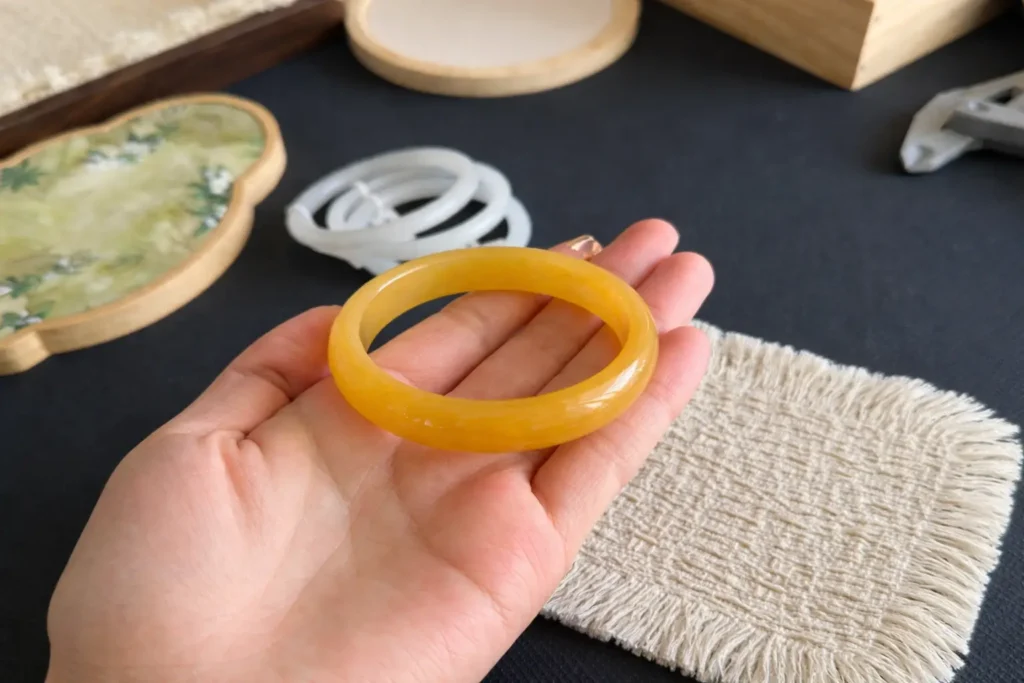 Huanglong Jade bracelet made of macrocrystalline quartz, a common quartzite jade variety.