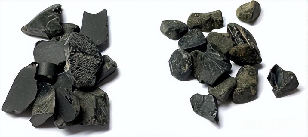 Opaque black spinel rough crystals from Thailand, showing natural octahedral shapes and luster.