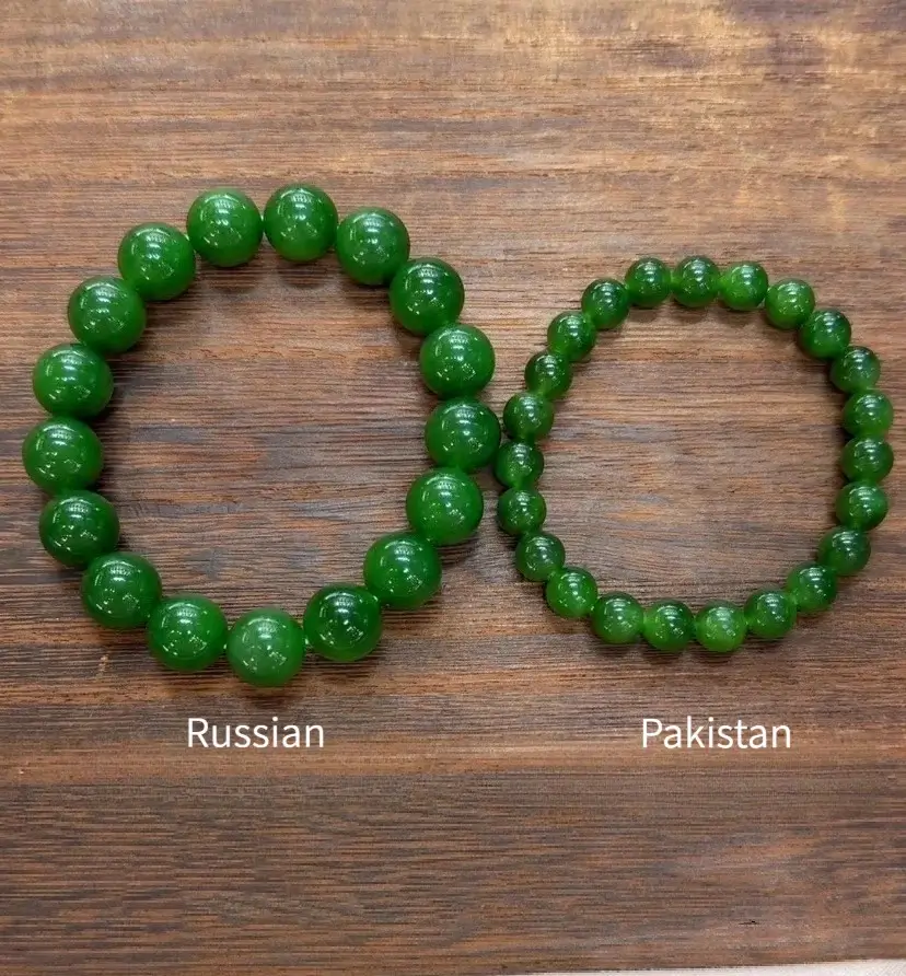 Comparing a saturated Russian spinach green bracelet and a translucent yellowish-green Pakistan jade.