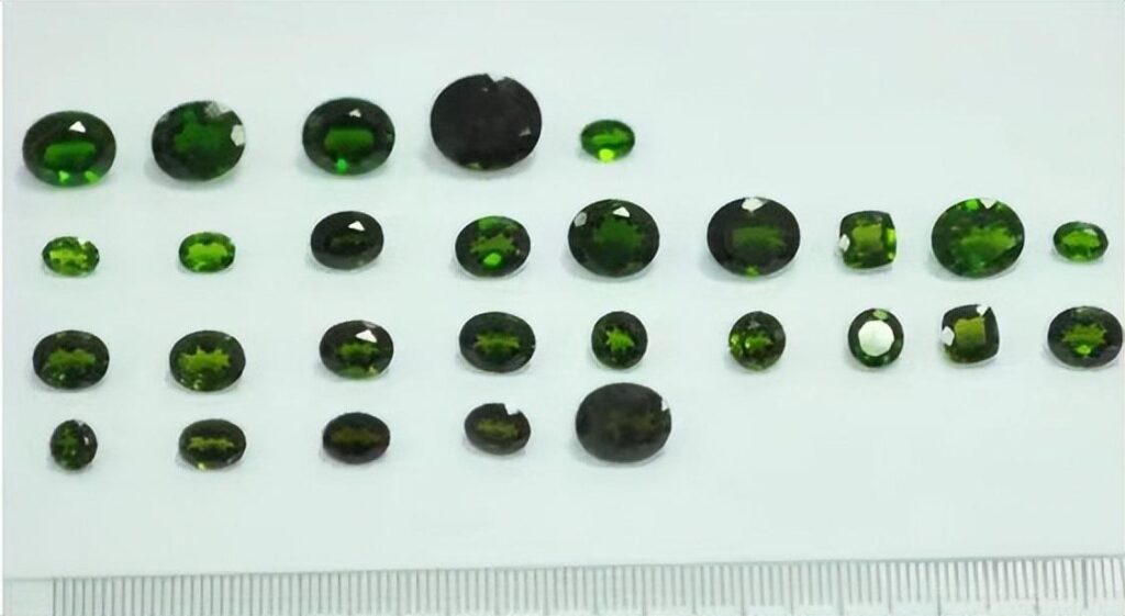 Gem-quality chromium diopside from Siberia’s Inagli Mine, showing large crystals in green and yellow-green shades.