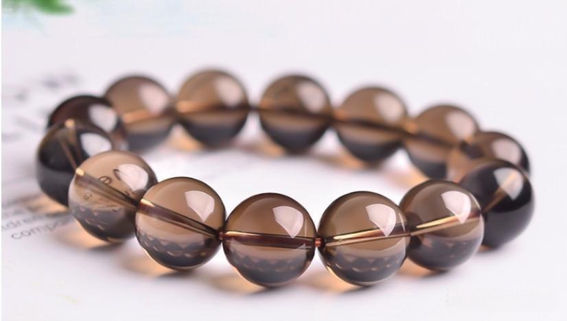 Smoky Quartz bracelet with brown and tea-colored beads, featuring natural color variations and inclusions.