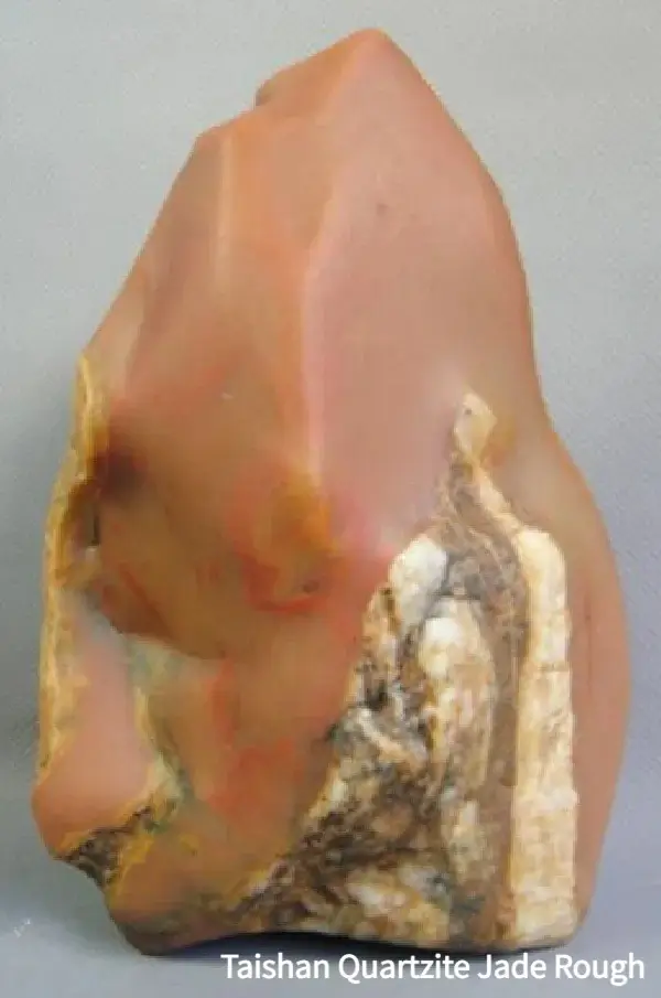 A raw Taishan Jade specimen from Guangdong, showcasing its characteristic waxy quartz structure.