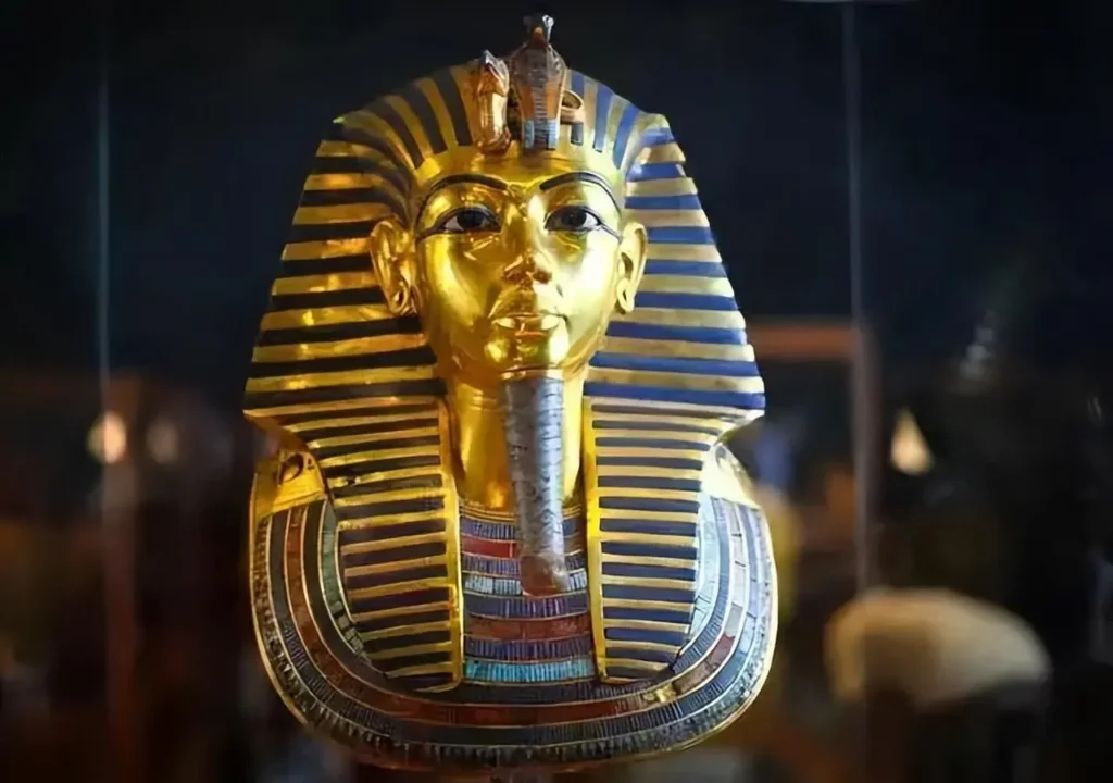 The funeral mask of Tutankhamun featuring intricate inlays of Egyptian gold and Afghan Lapis Lazuli.