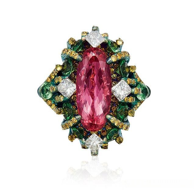 Sculptural ring by Wallace Chan featuring a large golden center stone and intricate goose motifs.