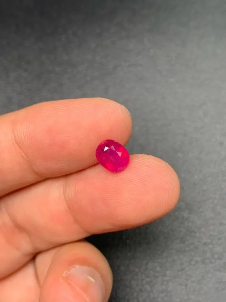 A 1.78ct unheated Winza ruby showing a clean table and vivid red color with internal inclusions.