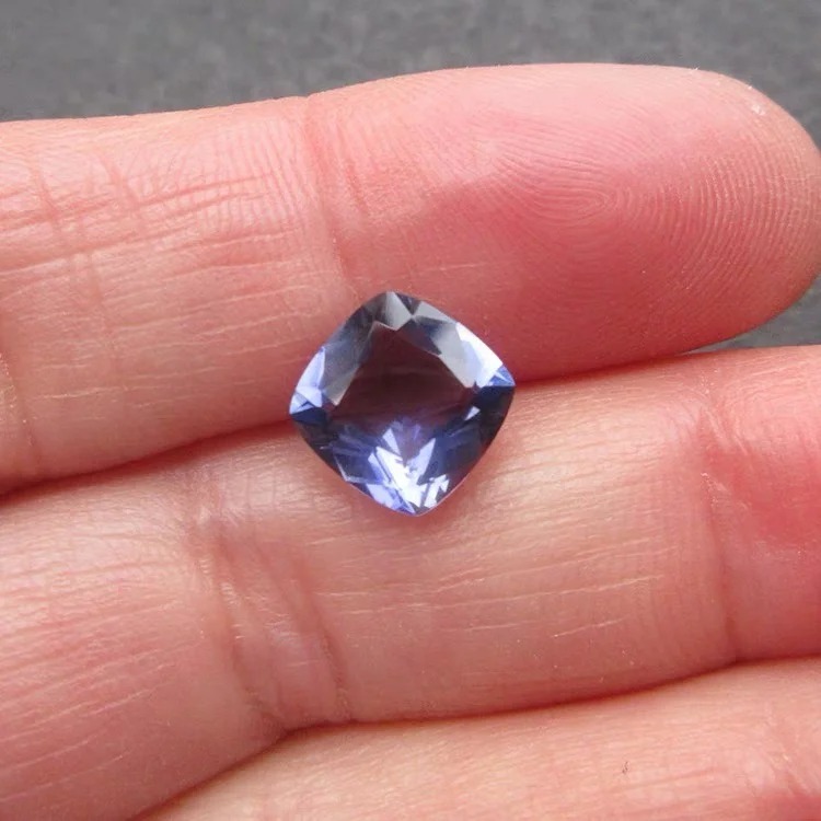Eye-clean 1.75ct cushion-cut violet Iolite gemstone from Africa, showing no visible inclusions.