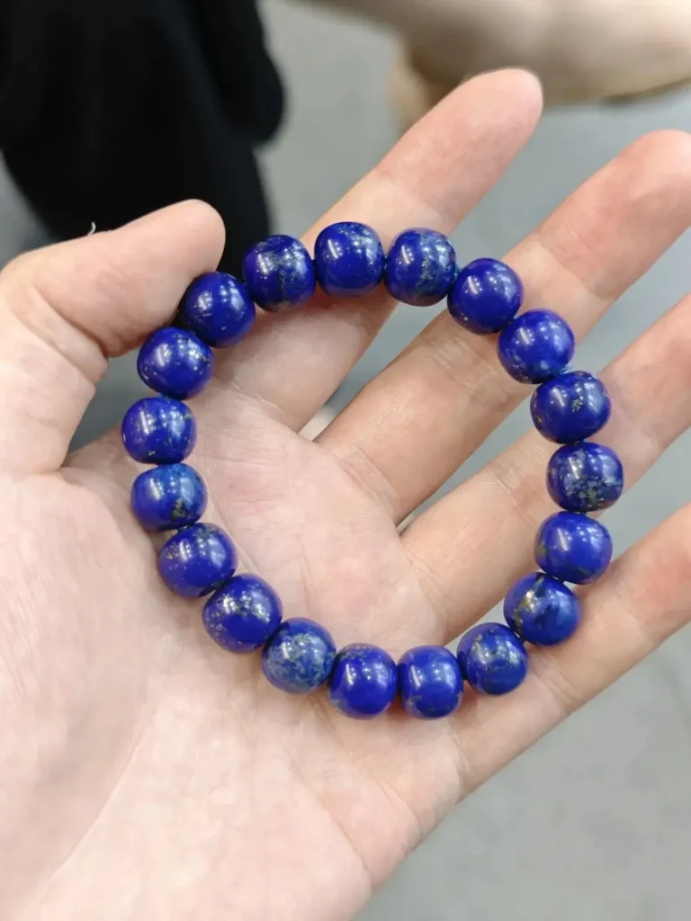 11mm new-mine lapis lazuli bracelet, 46.8g, featuring white calcite veins on a blue base.