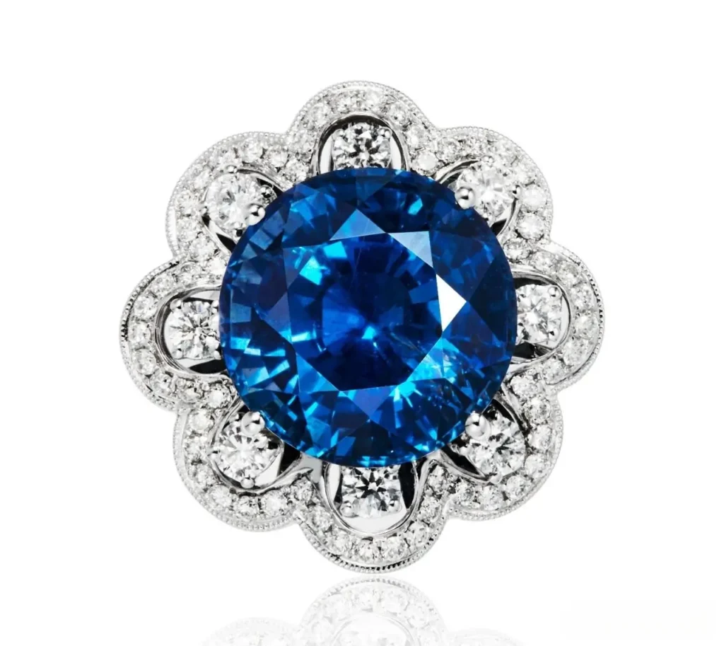 A 15.33ct unheated Tanzanian sapphire set in a diamond-halo ring and pendant dual-use design.
