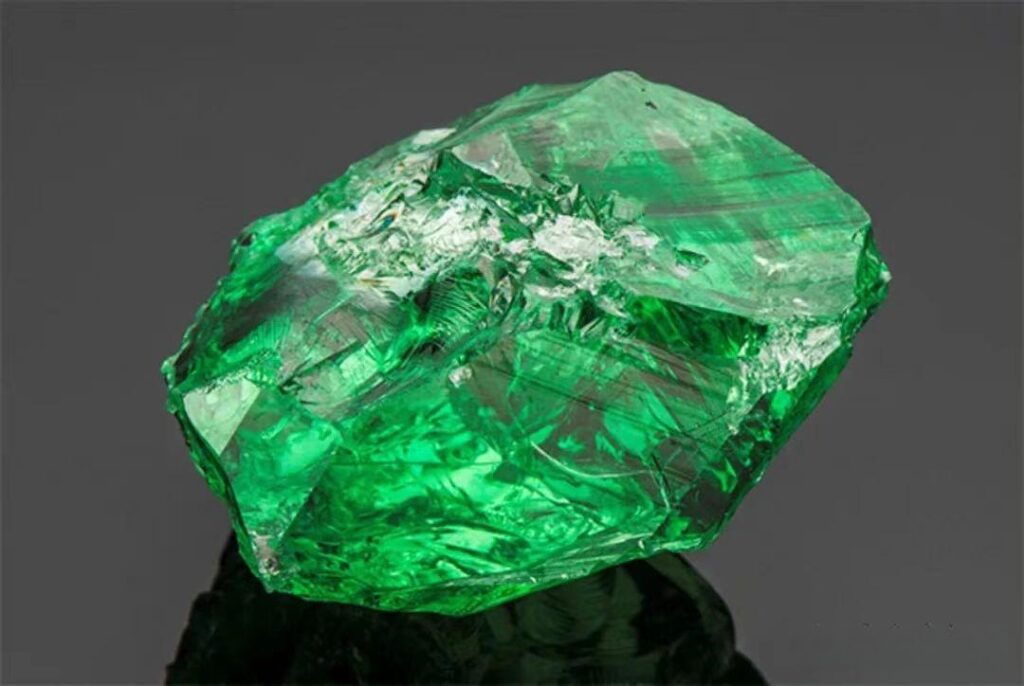 Massive 283.74ct green tsavorite rough from Merelani, Tanzania, showing raw crystalline structure.