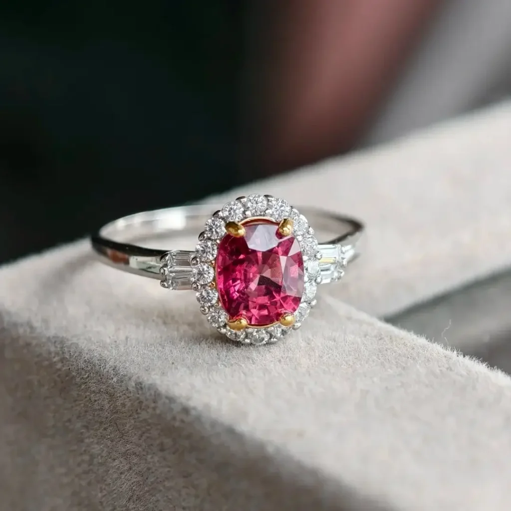 A 925 silver halo ring featuring a central red stone.