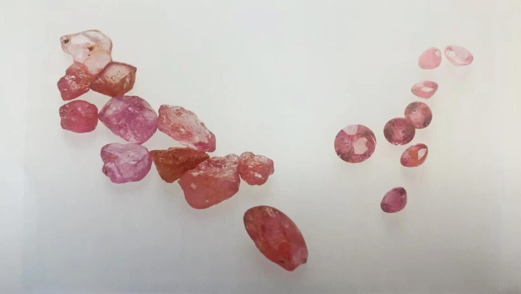 Australian ruby crystal next to a faceted gemstone from the Barrington Tops mining deposit.