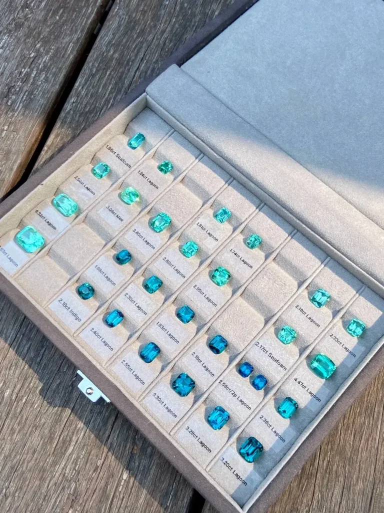 A diverse array of Lagoon and Indigo tourmalines in varying carat weights and color saturations.