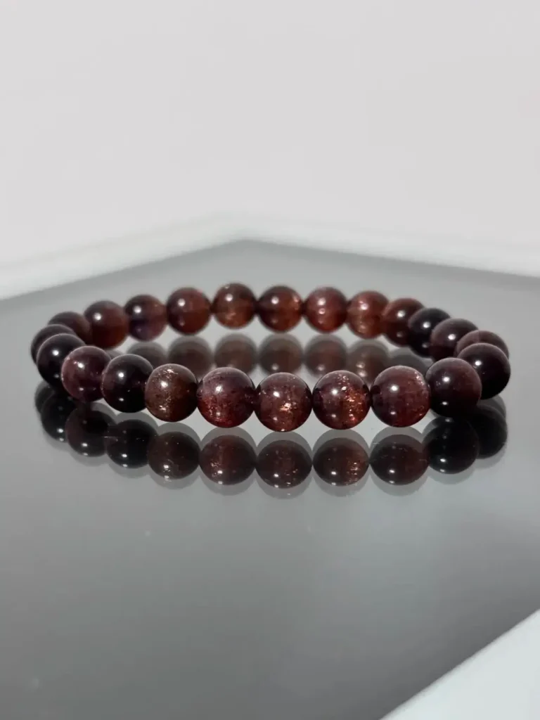 Iolite Viking Compass beads with golden-red cat's eye chatoyancy caused by hematite and parallel inclusions.