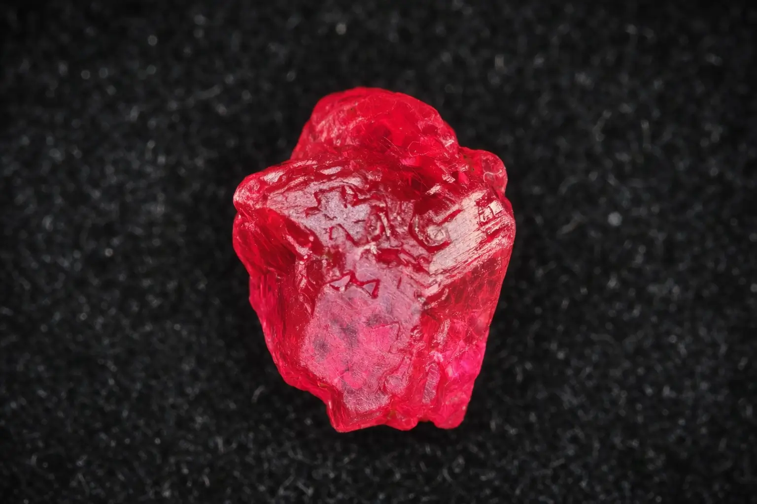 A 1.95-carat red Jedi spinel macle twin crystal specimen from Man Sin, Myanmar.