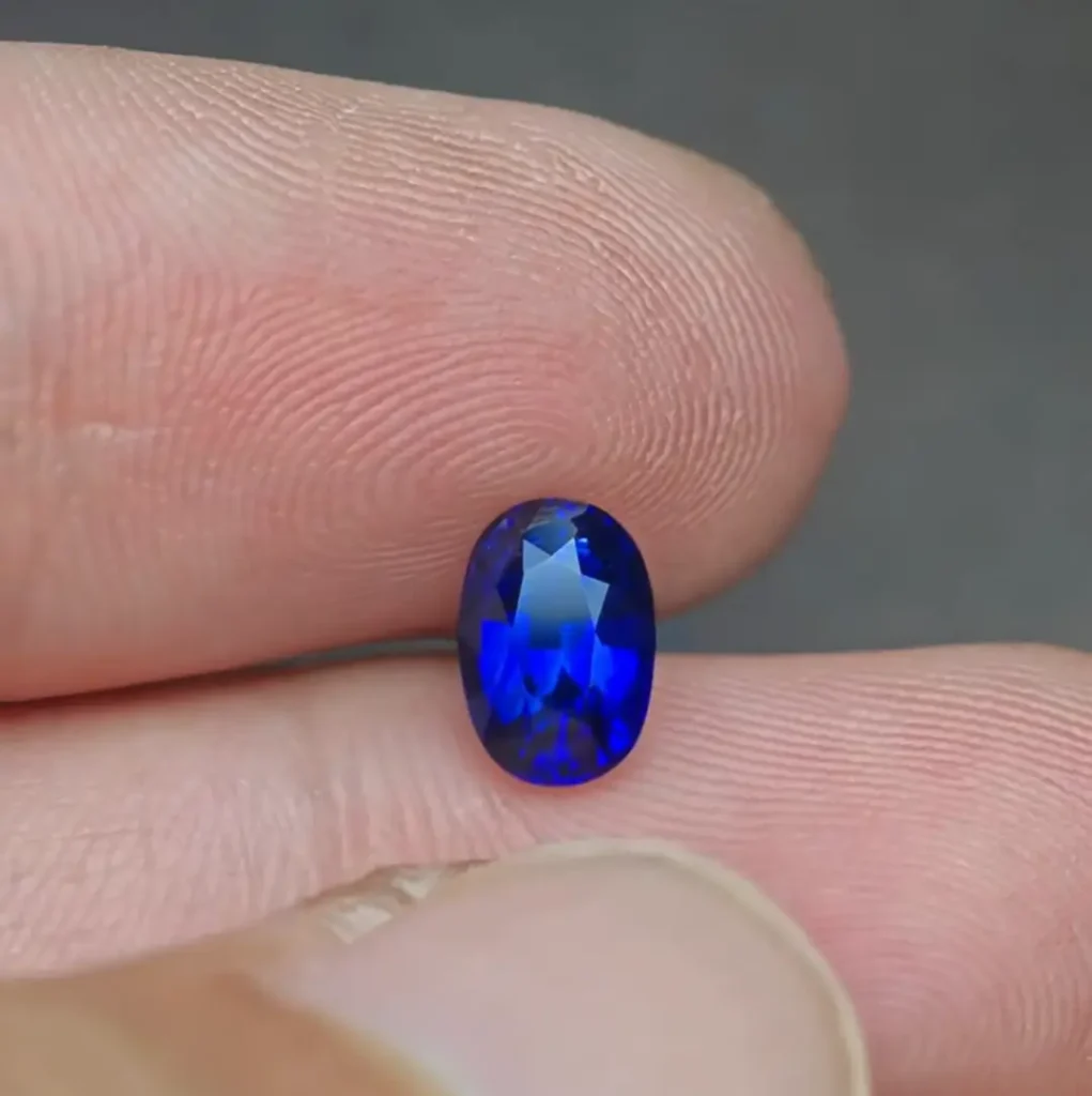 Top-down view of a faceted Ottu sapphire displaying uniform Royal Blue saturation.