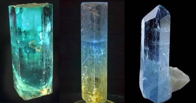 A group of natural hexagonal aquamarine crystals in pale blue and sea-foam green shades.