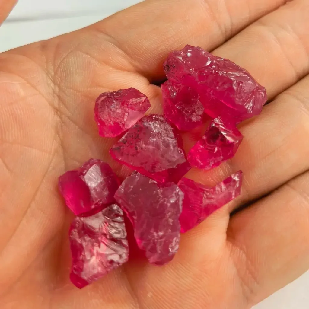 A group of rough red Mahenge spinel crystals from Tanzania.