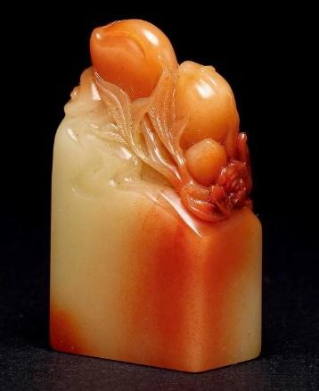 A Shoushan Furong stone square seal with a peach-shaped knob.
