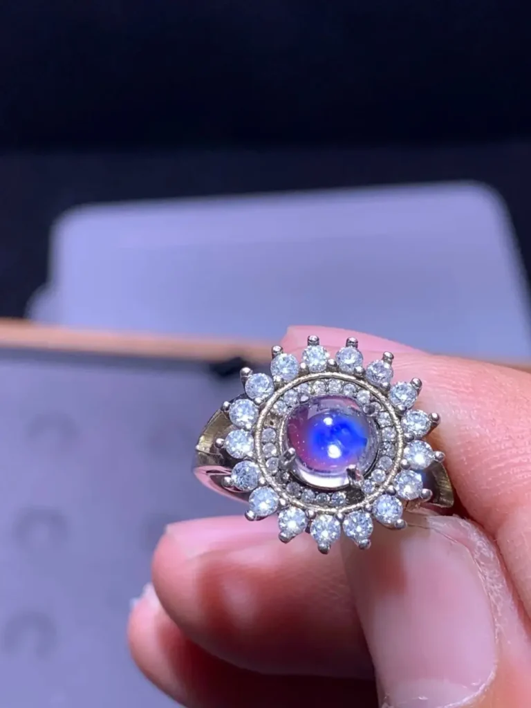 A silver ring featuring a Sri Lankan moonstone with a distinct blue adularescence glow.