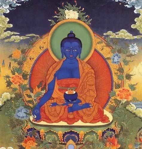 Medicine Buddha with a radiant body in the sacred color of blue.